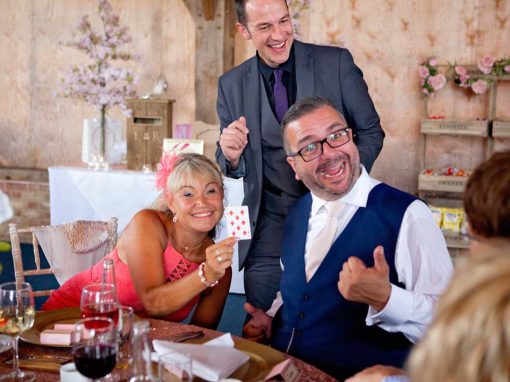 Close-up card magic at wedding breakfast table
